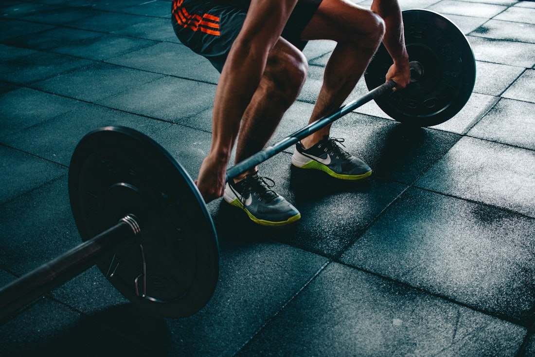 Athlete setting up a barbell deadlift